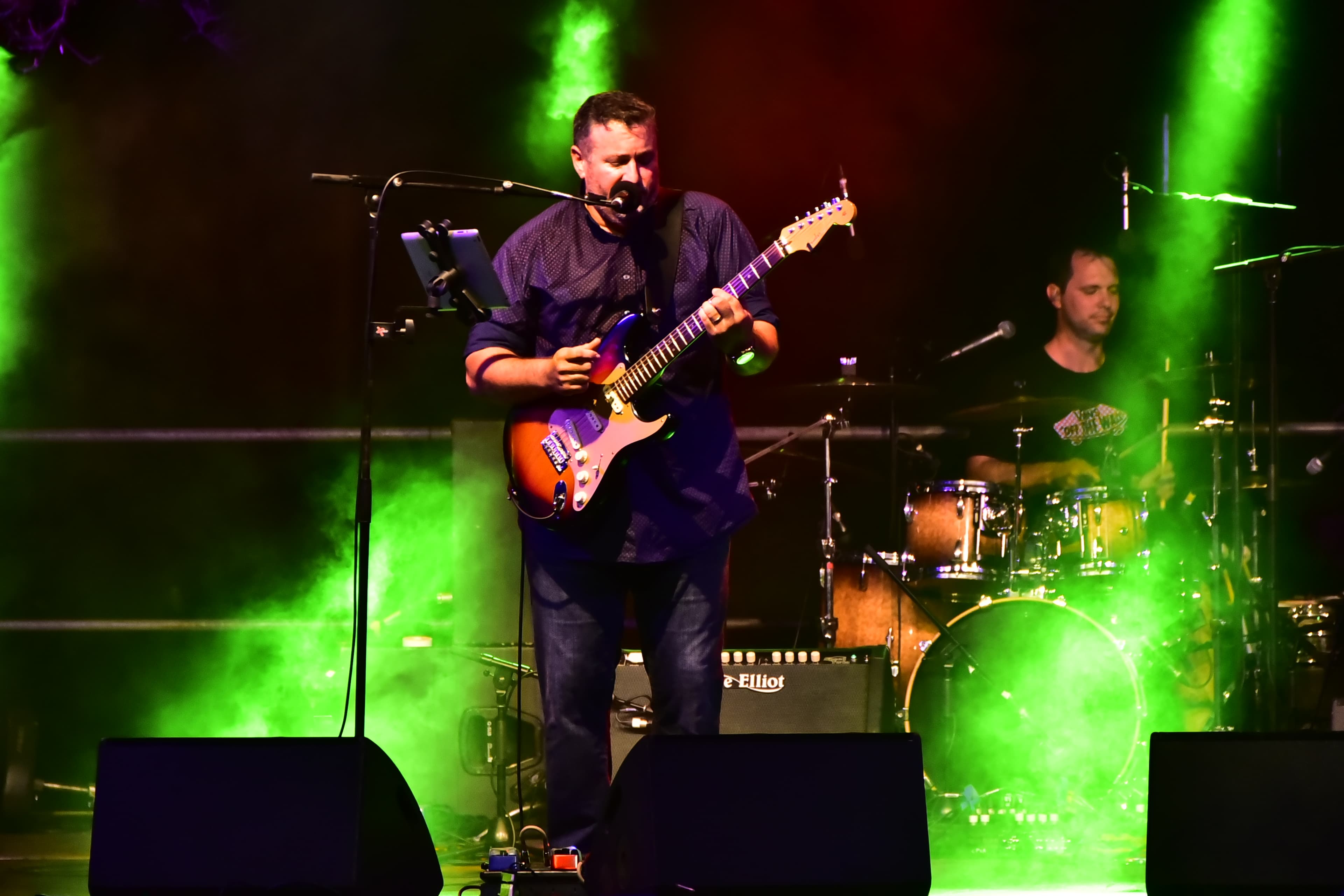 Paul Bonanno performing lead vocals and rhythm guitar with The Embassy Project