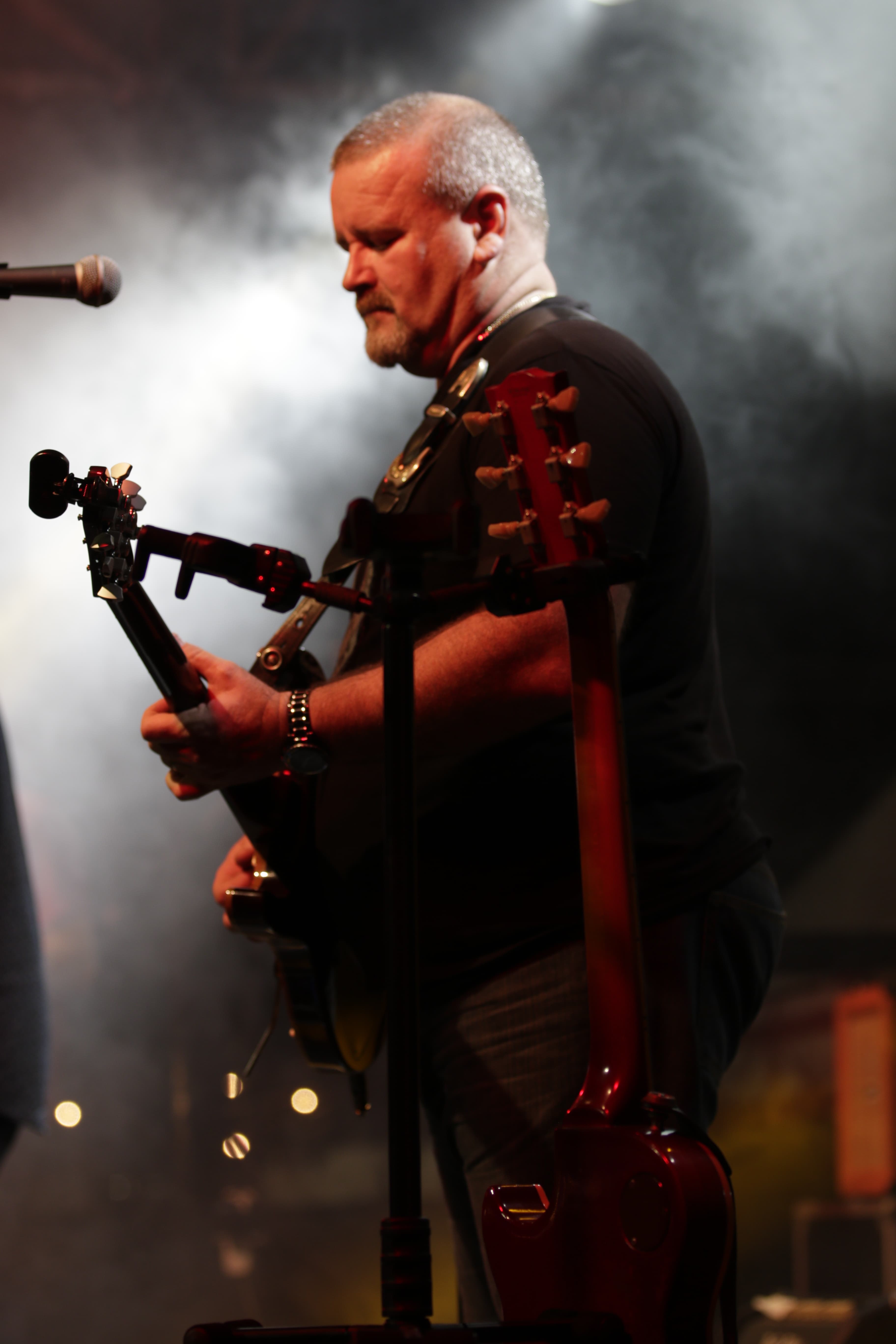 Shane Marschall playing lead guitar with The Embassy Project